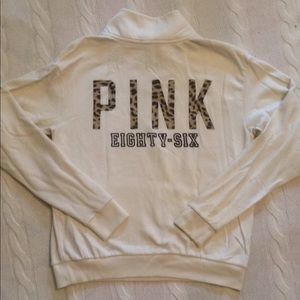 Ivory 1/4 zip pullover with cheetah pink logo